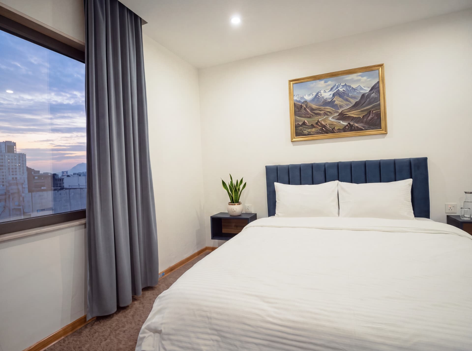 King Suite king bed with skyline window