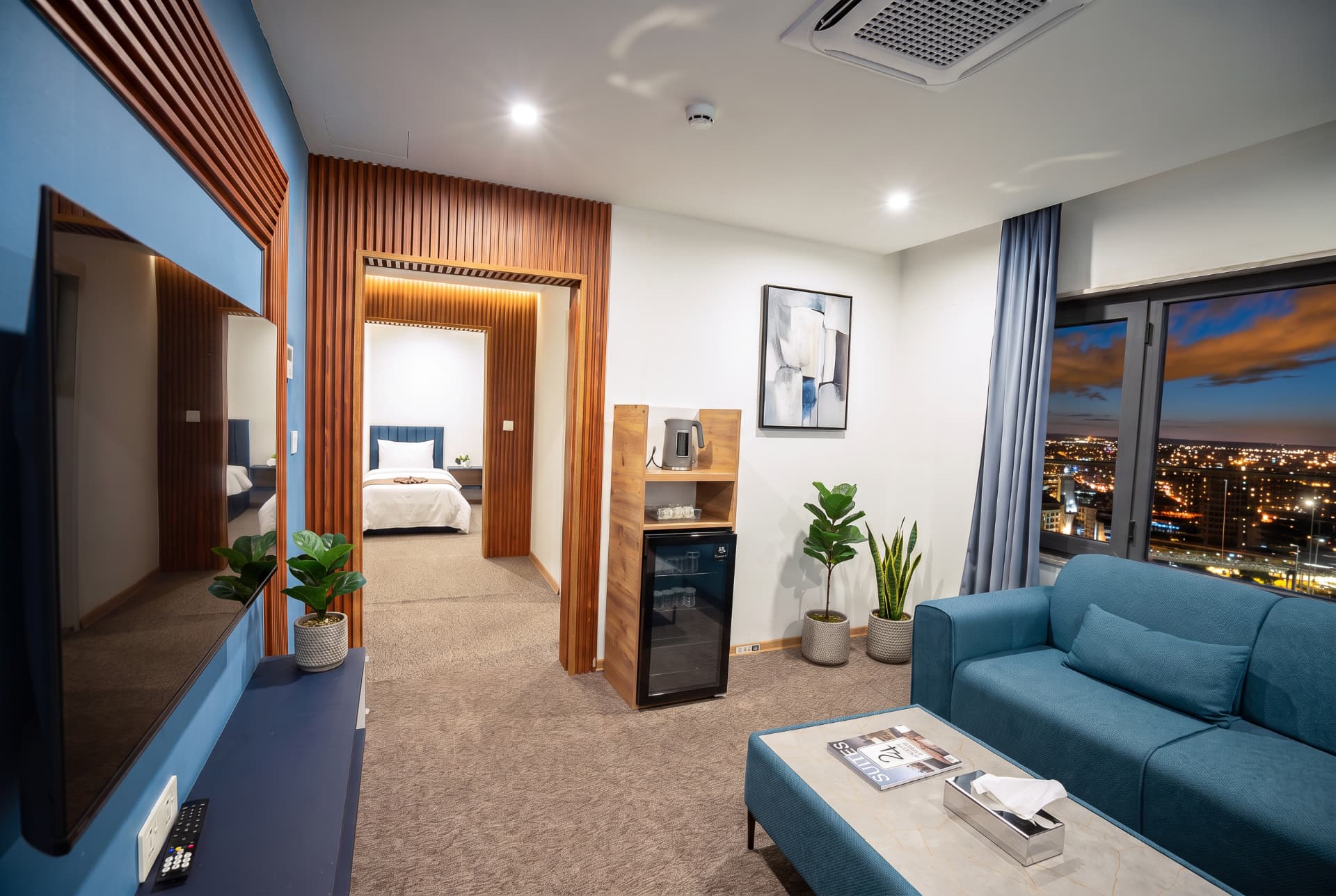 Standard Suite lounge with city lights at night